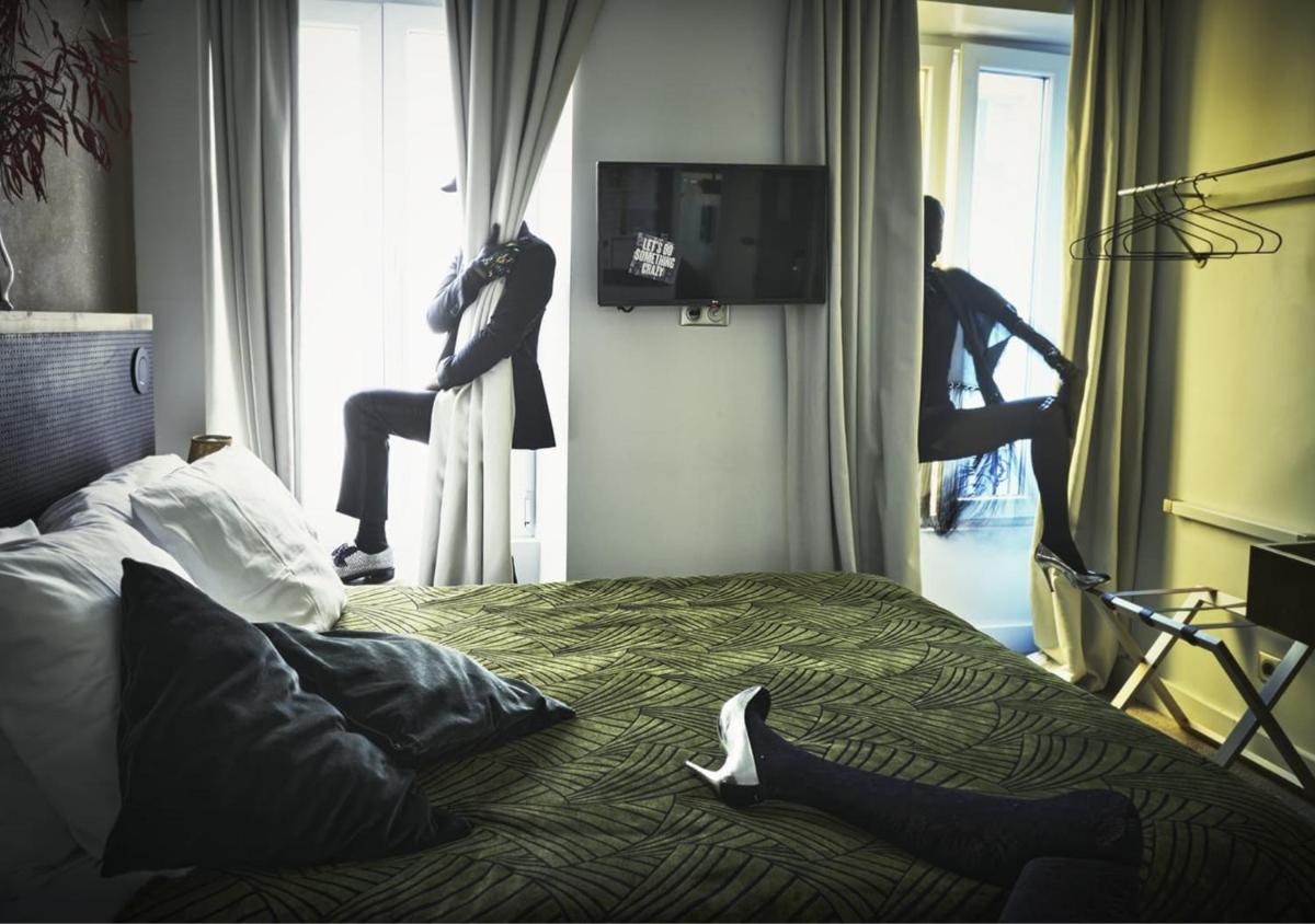 Télévision ou salle de divertissement dans l'établissement Hôtel La Nouvelle République & Hammam