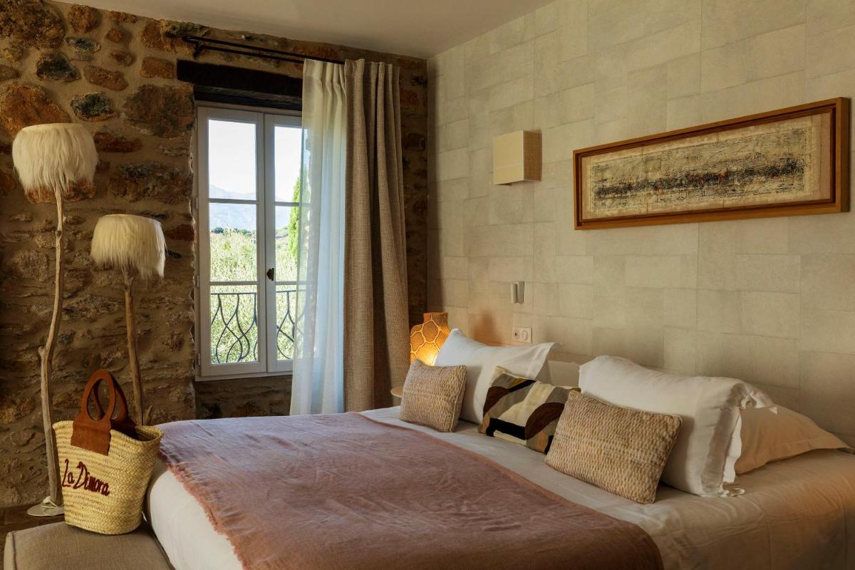 Un ou plusieurs lits dans un hébergement de l'établissement Hôtel La Dimora & Spa