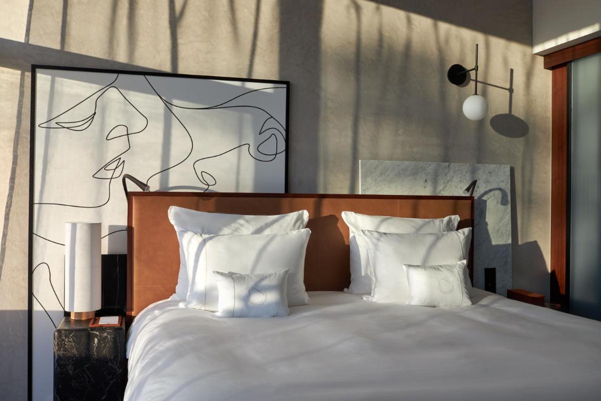 Un ou plusieurs lits dans un hébergement de l'établissement L'Esquisse Hotel & Spa Colmar - MGallery Collection