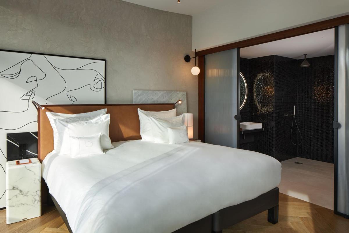 Un ou plusieurs lits dans un hébergement de l'établissement L'Esquisse Hotel & Spa Colmar - MGallery Collection