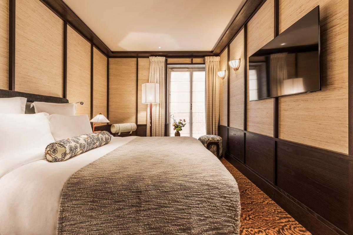 Un ou plusieurs lits dans un hébergement de l'établissement Hotel Hana
