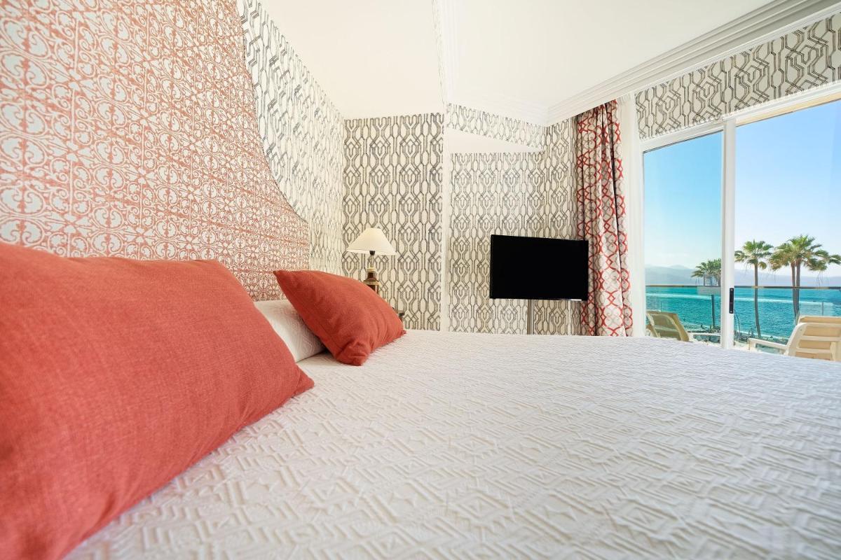 Cama o camas de una habitación en Bull Reina Isabel & SPA