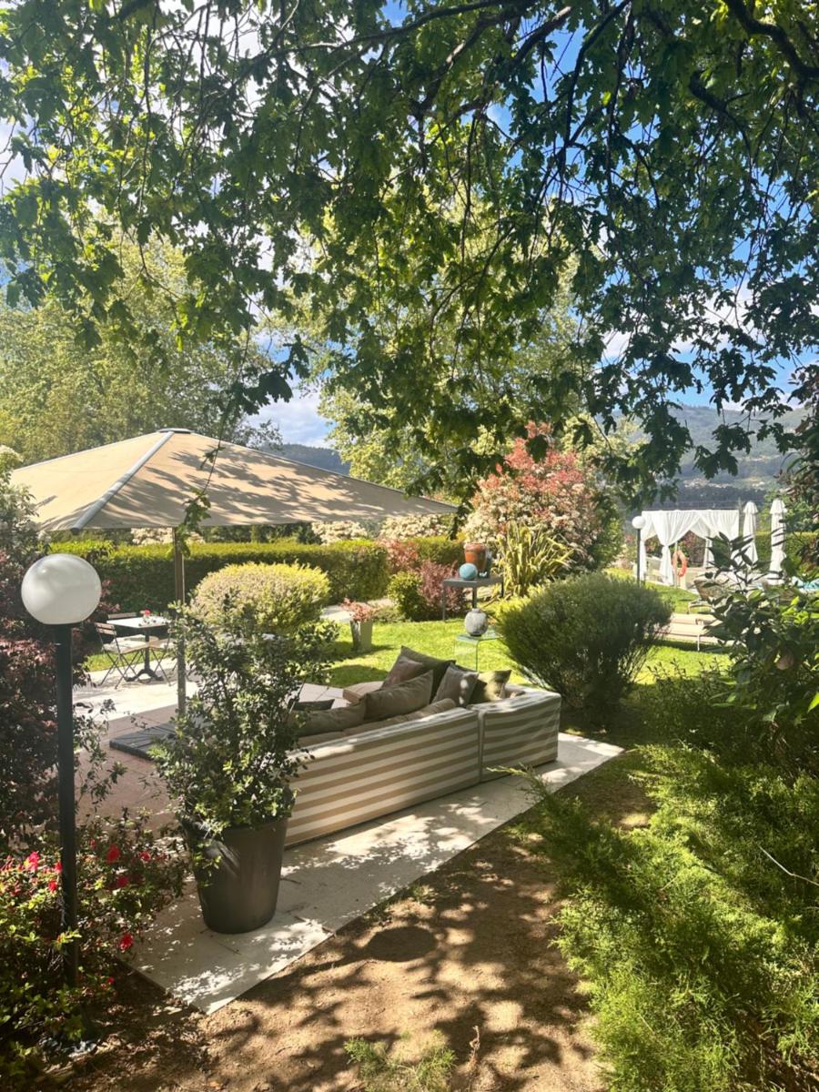 Um jardim no exterior de Carmo's Boutique Hotel - Small Luxury Hotels of the World