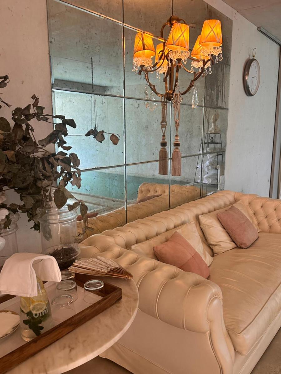 uma sala de estar com um sofá e uma mesa em Carmo's Boutique Hotel - Small Luxury Hotels of the World em Ponte de Lima