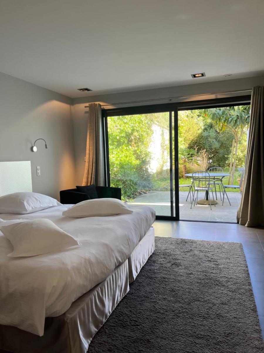 Un ou plusieurs lits dans un hébergement de l'établissement Lafitenia Resort