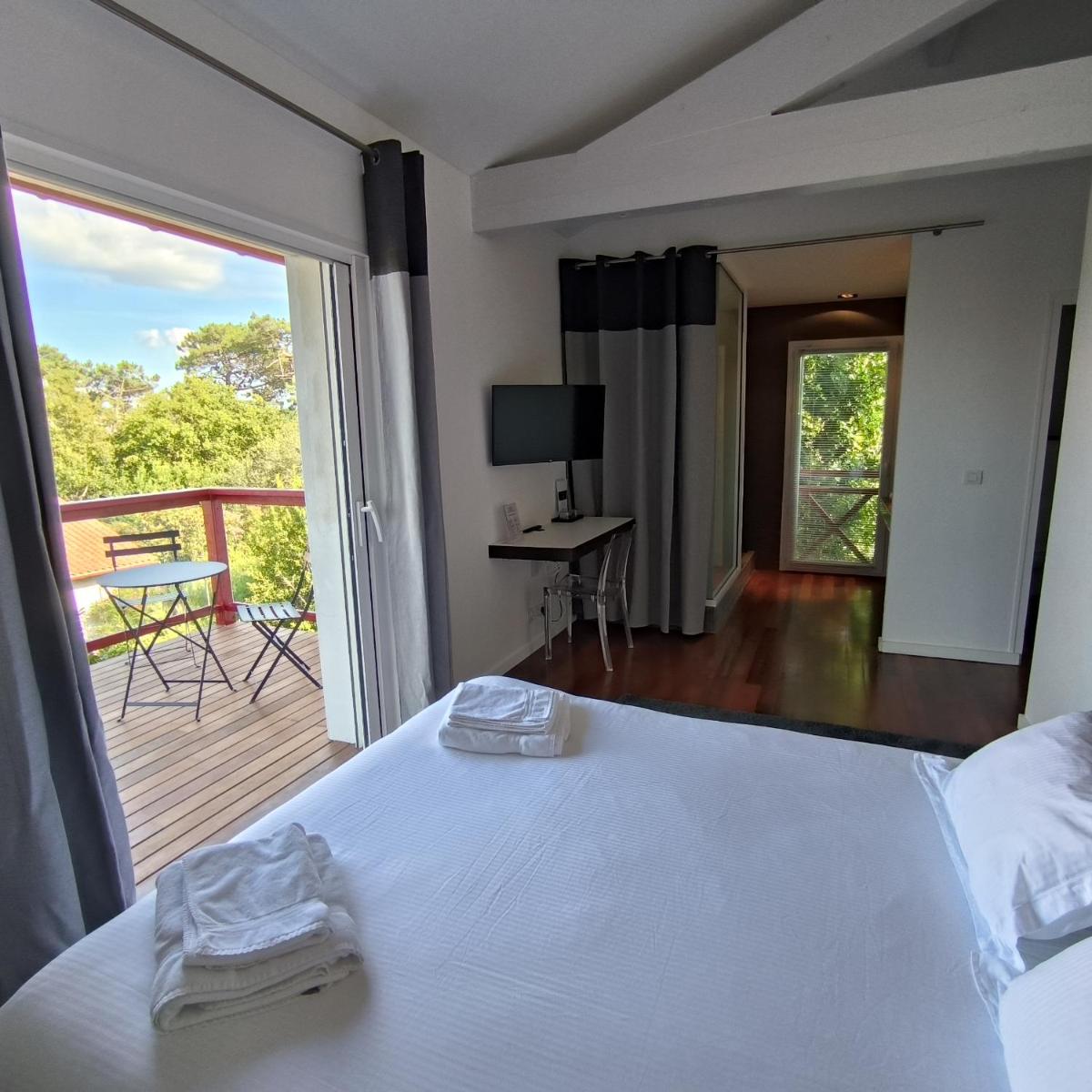Un ou plusieurs lits dans un hébergement de l'établissement Lafitenia Resort