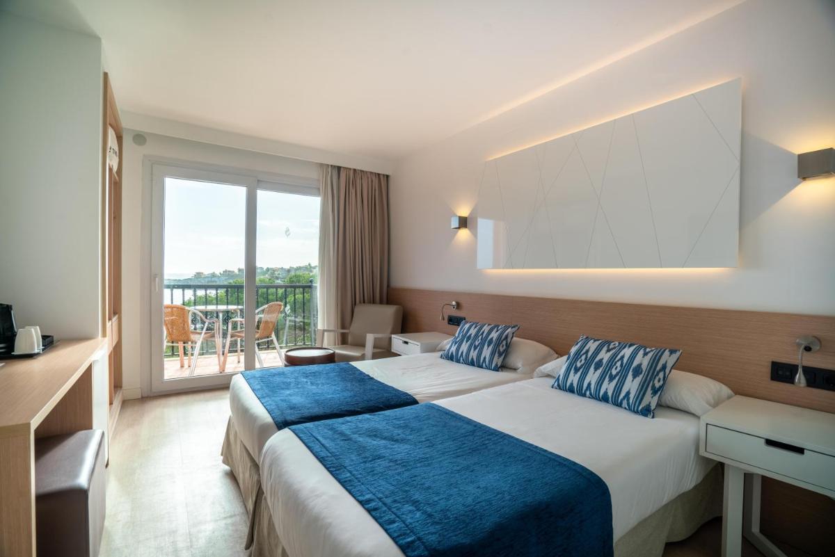 Cama o camas de una habitación en THB Felip - Adults Only