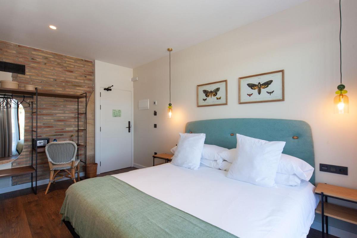 Cama o camas de una habitación en Duruelo Mountain Suites