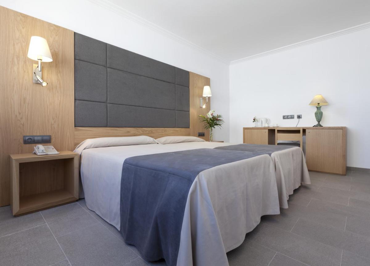 Cama o camas de una habitación en Hotel Artmadams