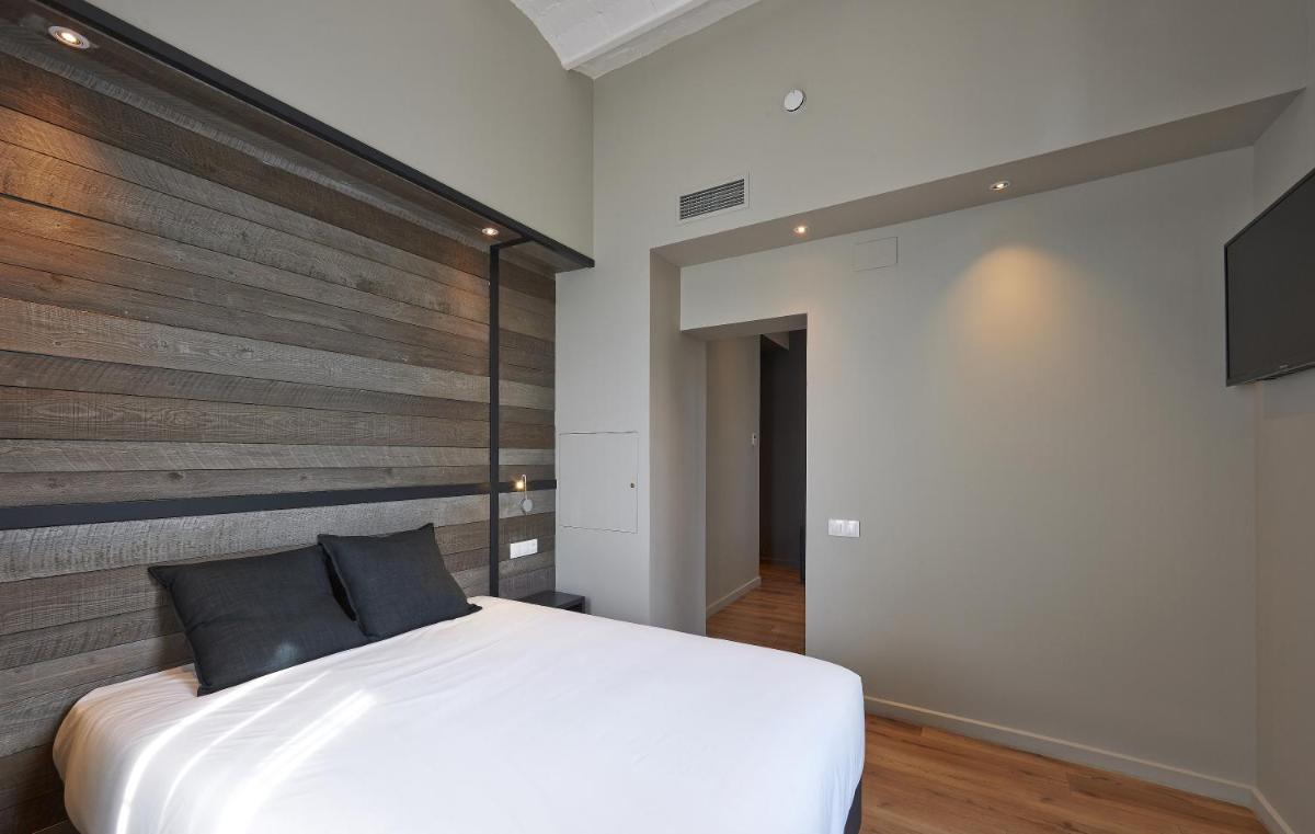 Cama o camas de una habitación en Hotel Parada Puigcerda