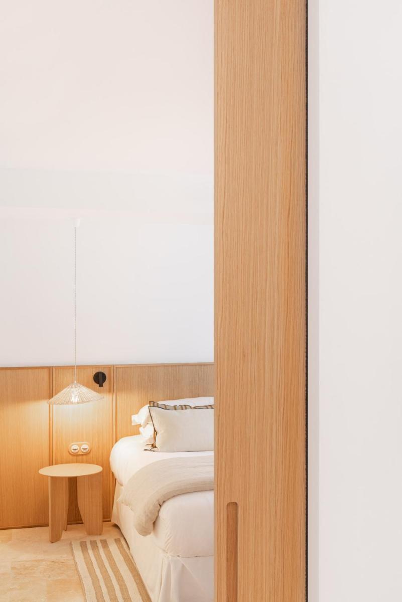 Un ou plusieurs lits dans un hébergement de l'établissement Le Couvent des Minimes, un Hôtel & Spa L'Occitane en Provence
