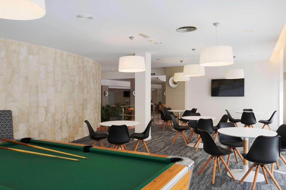 Una televisión o centro de entretenimiento en Alua Illa de Menorca