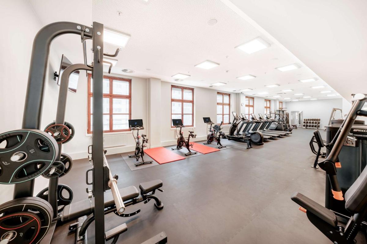 Das Fitnesscenter und/oder die Fitnesseinrichtungen in der Unterkunft Hilton Berlin Das Fitnesscenter und/oder die Fitnesseinrichtungen in der Unterkunft Hilton Berlin