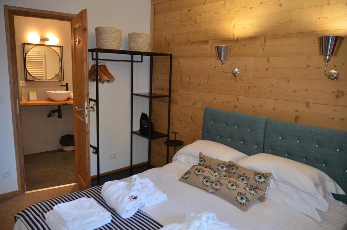 Un ou plusieurs lits dans un hébergement de l'établissement Hôtel et Chalet Au Coin Du Feu Chilly Powder