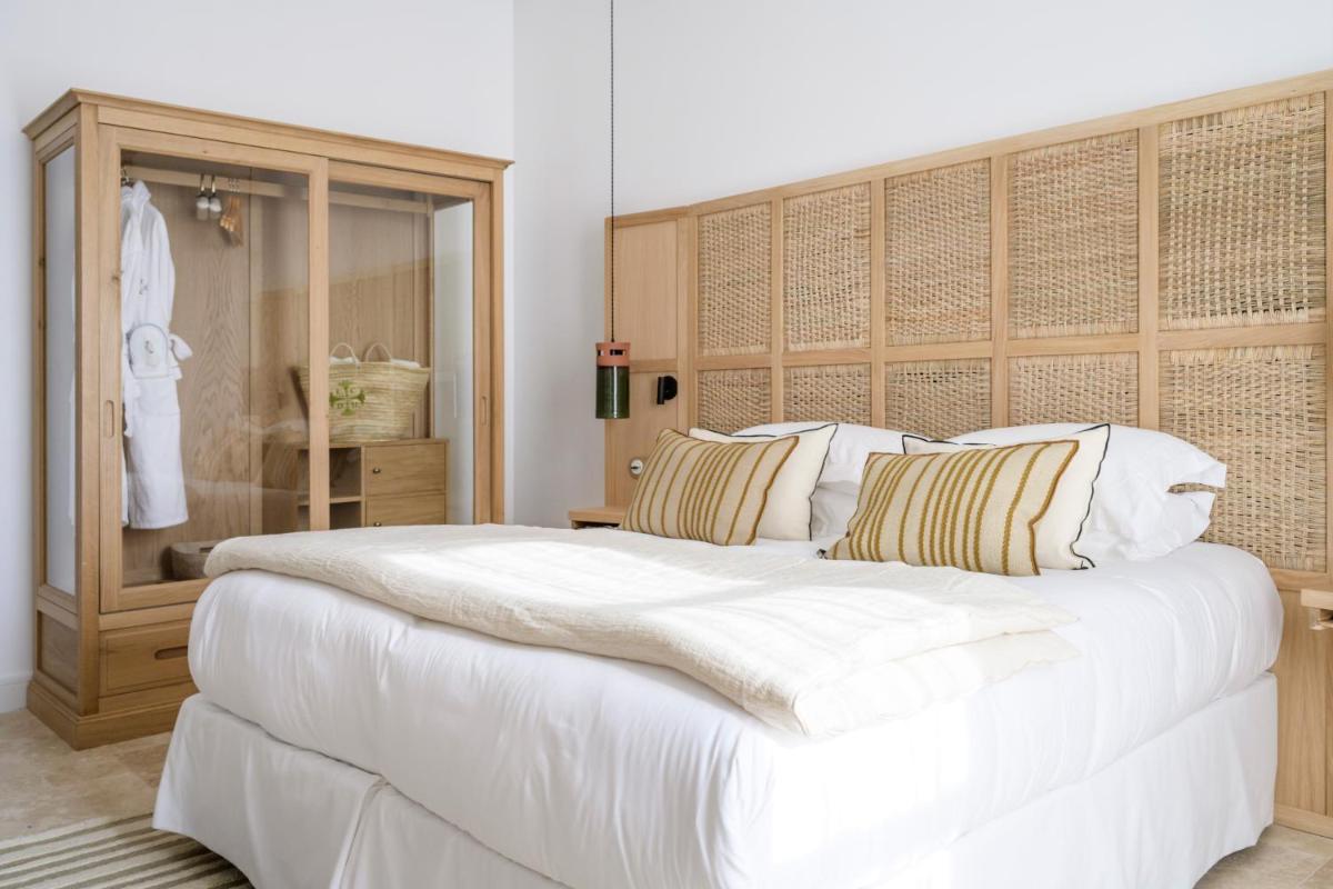 Un ou plusieurs lits dans un hébergement de l'établissement Le Couvent des Minimes, un Hôtel & Spa L'Occitane en Provence