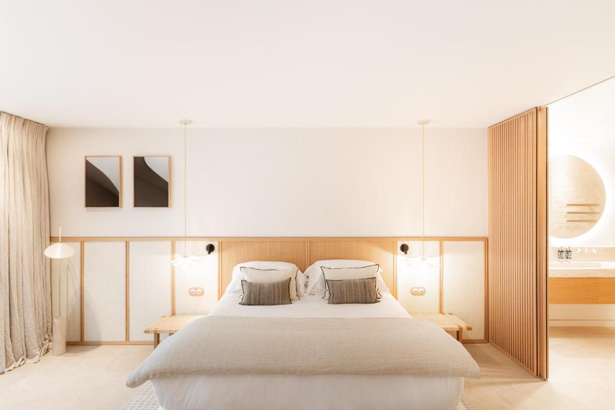Un ou plusieurs lits dans un hébergement de l'établissement Le Couvent des Minimes, un Hôtel & Spa L'Occitane en Provence