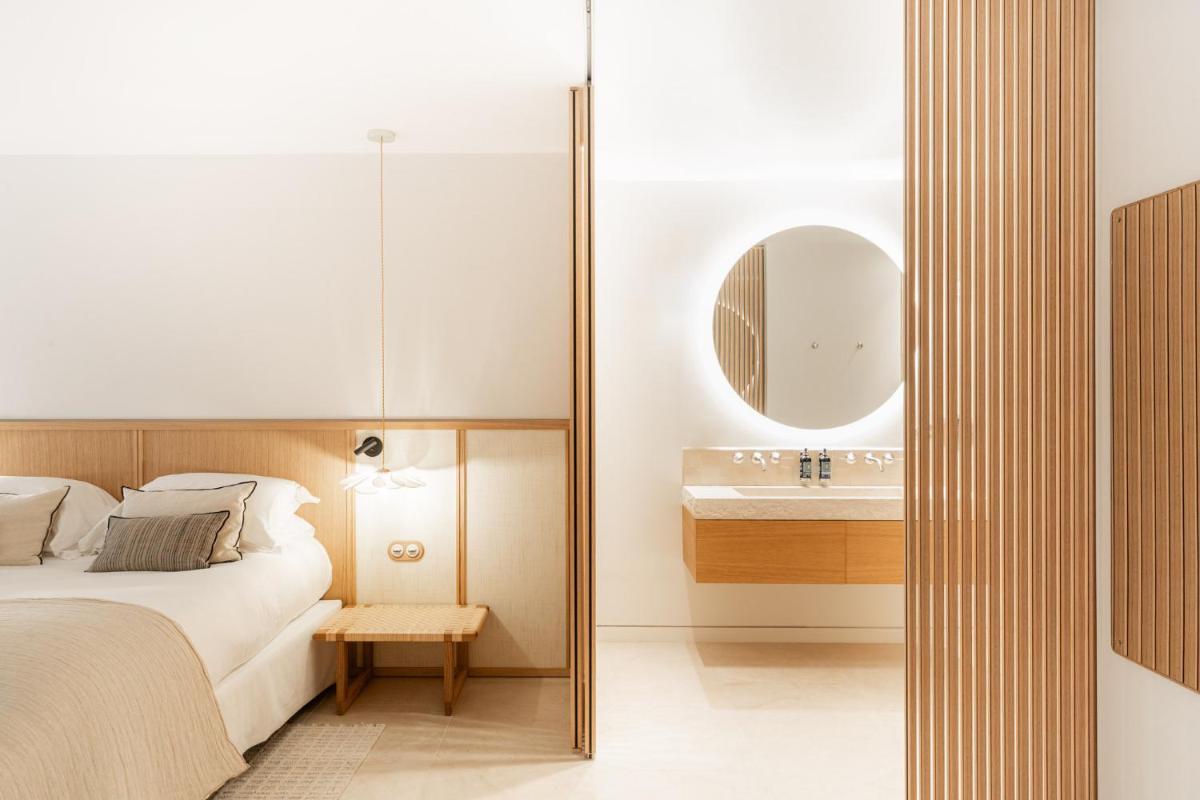 Un ou plusieurs lits dans un hébergement de l'établissement Le Couvent des Minimes, un Hôtel & Spa L'Occitane en Provence