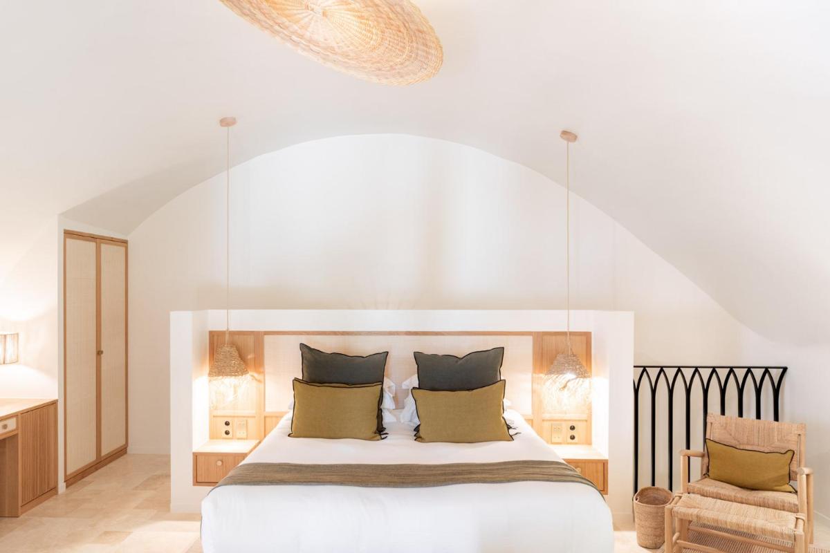 Un ou plusieurs lits dans un hébergement de l'établissement Le Couvent des Minimes, un Hôtel & Spa L'Occitane en Provence