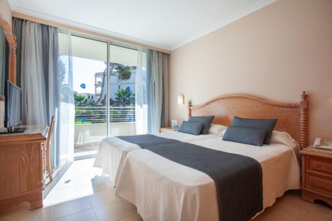 Cama o camas de una habitación en Grupotel Natura Playa