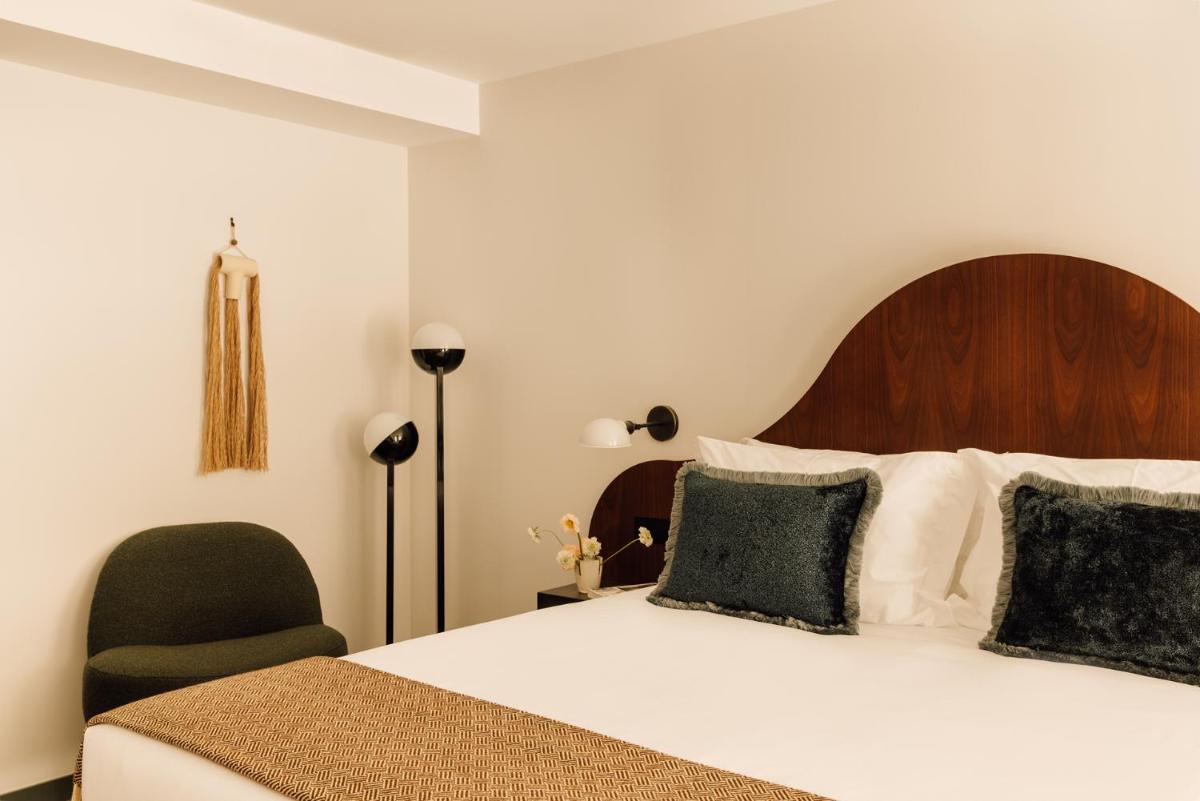 Uma cama ou camas num quarto em The Rebello Hotel & Spa - Small Luxury Hotels Of The World