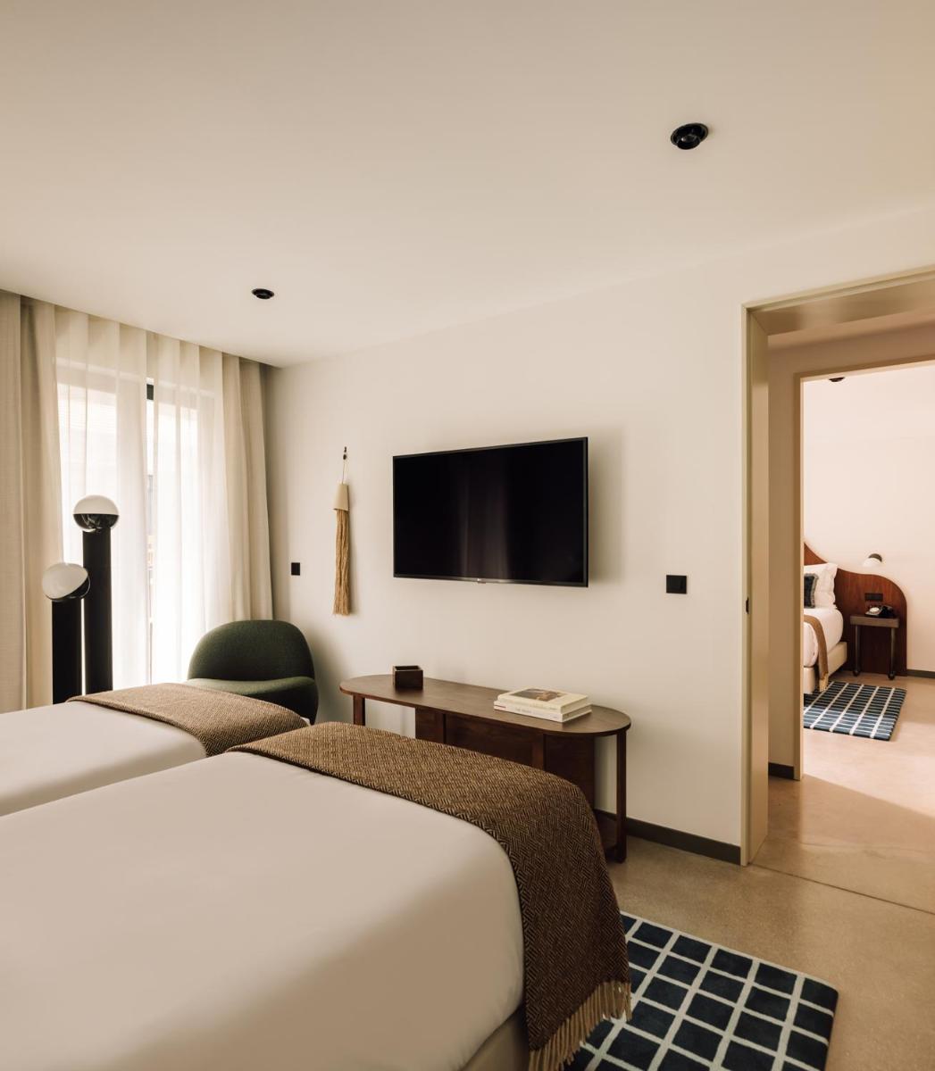 Uma cama ou camas num quarto em The Rebello Hotel & Spa - Small Luxury Hotels Of The World