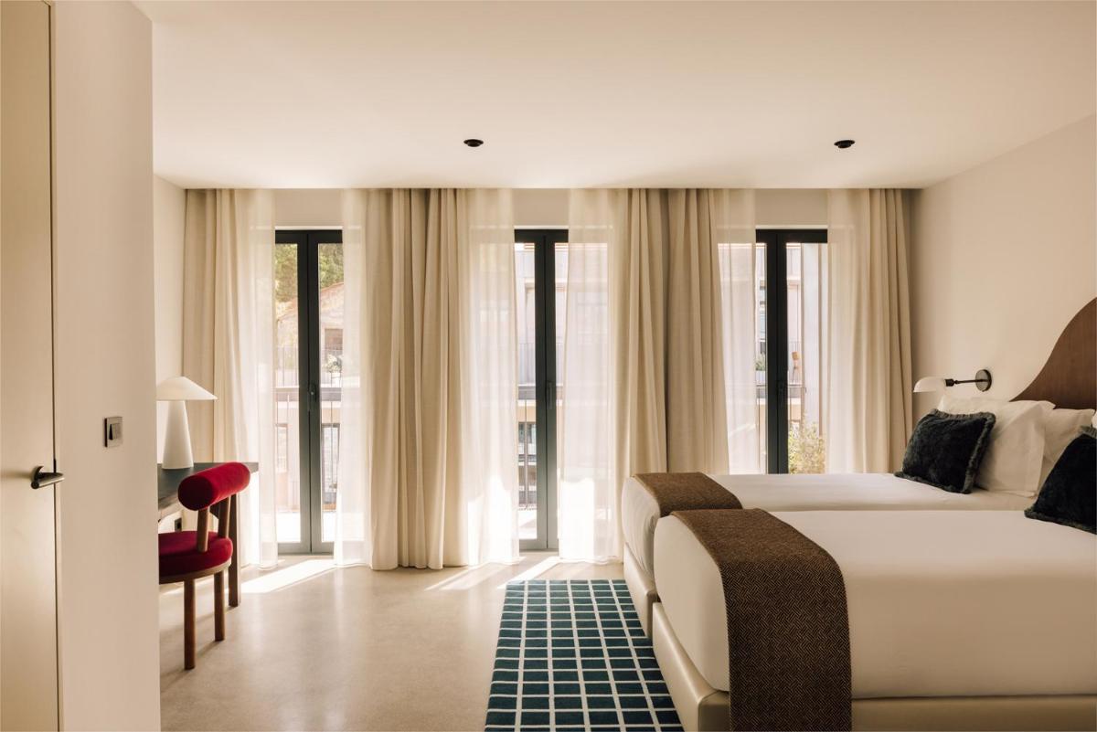 Uma cama ou camas num quarto em The Rebello Hotel & Spa - Small Luxury Hotels Of The World