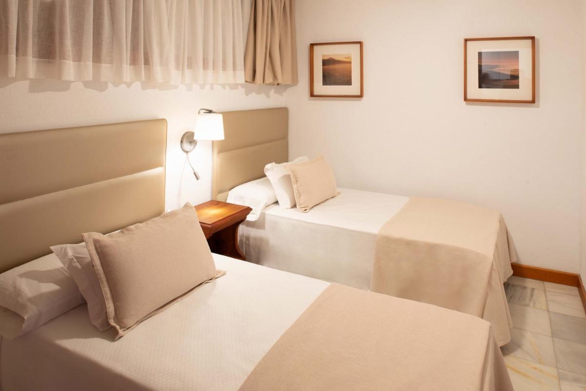 Cama o camas de una habitación en Parque Santiago III Official