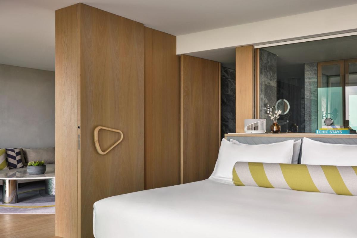 Uma cama ou camas num quarto em W Residences Algarve