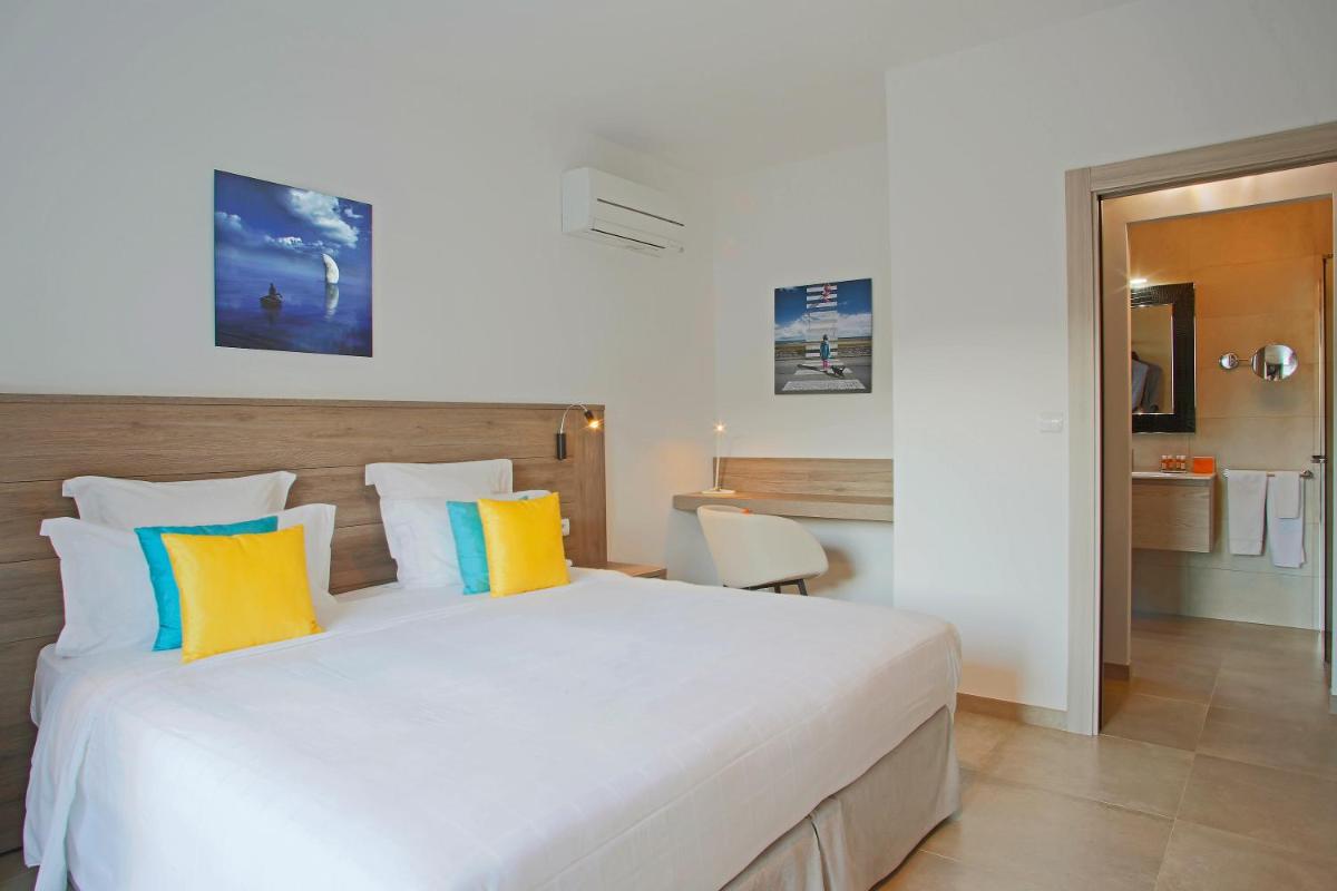 Un ou plusieurs lits dans un hébergement de l'établissement Domaine Villas Mandarine Private Pools & Spa