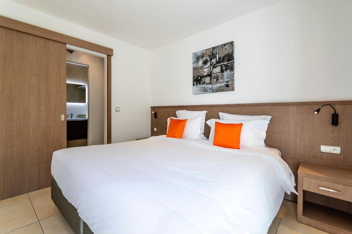 Un ou plusieurs lits dans un hébergement de l'établissement Domaine Villas Mandarine Private Pools & Spa