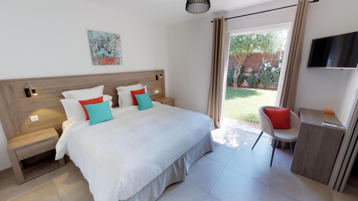 Un ou plusieurs lits dans un hébergement de l'établissement Domaine Villas Mandarine Private Pools & Spa