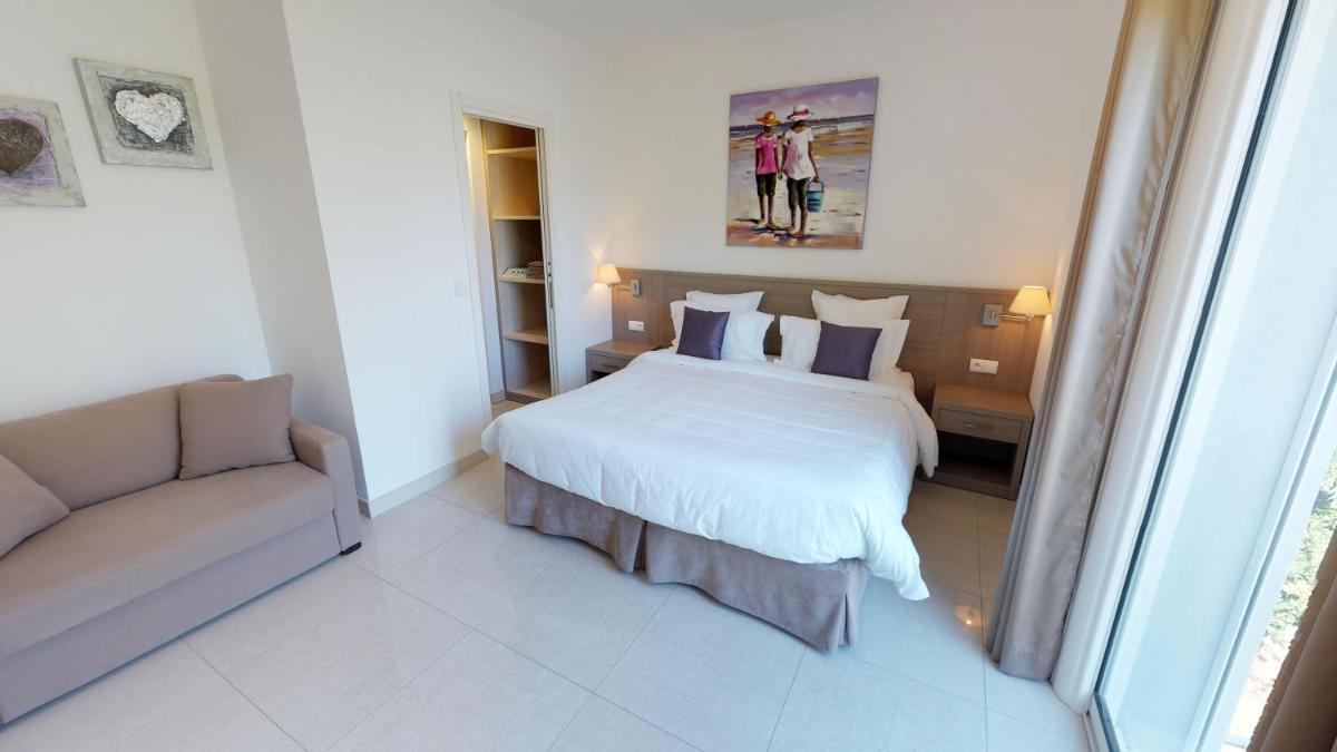 Un ou plusieurs lits dans un hébergement de l'établissement Domaine Villas Mandarine Private Pools & Spa