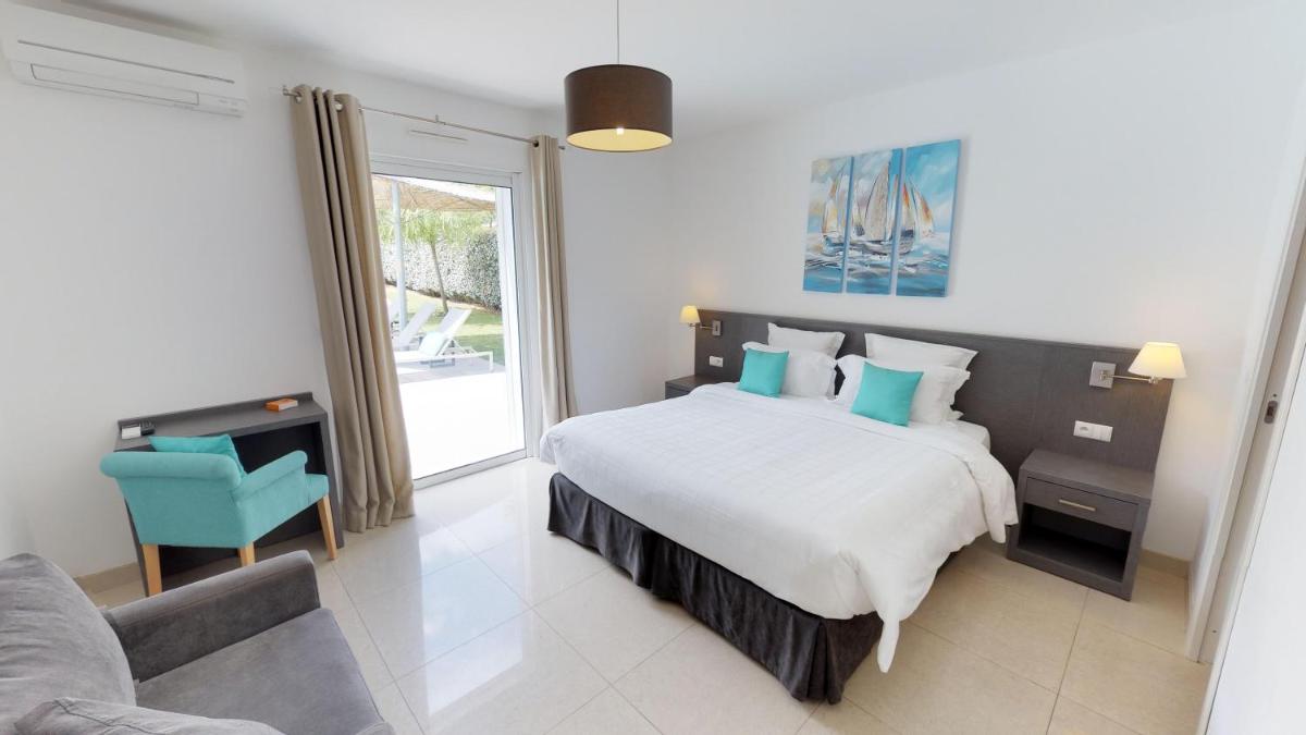 Un ou plusieurs lits dans un hébergement de l'établissement Domaine Villas Mandarine Private Pools & Spa