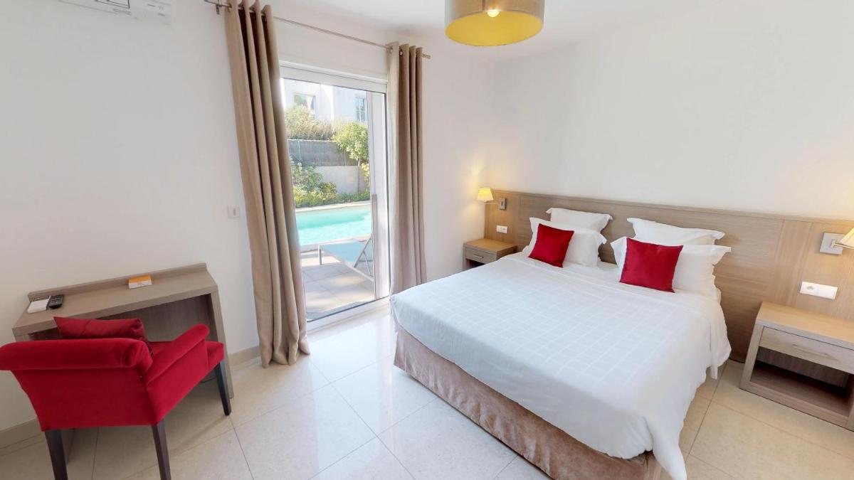 Un ou plusieurs lits dans un hébergement de l'établissement Domaine Villas Mandarine Private Pools & Spa