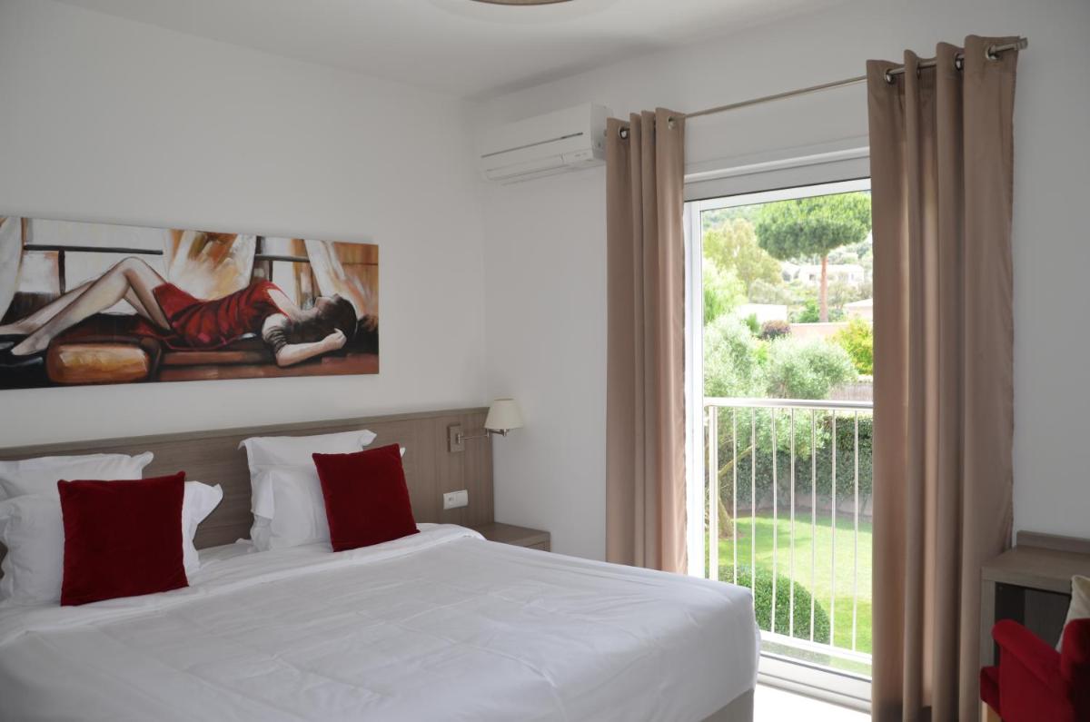 Un ou plusieurs lits dans un hébergement de l'établissement Domaine Villas Mandarine Private Pools & Spa