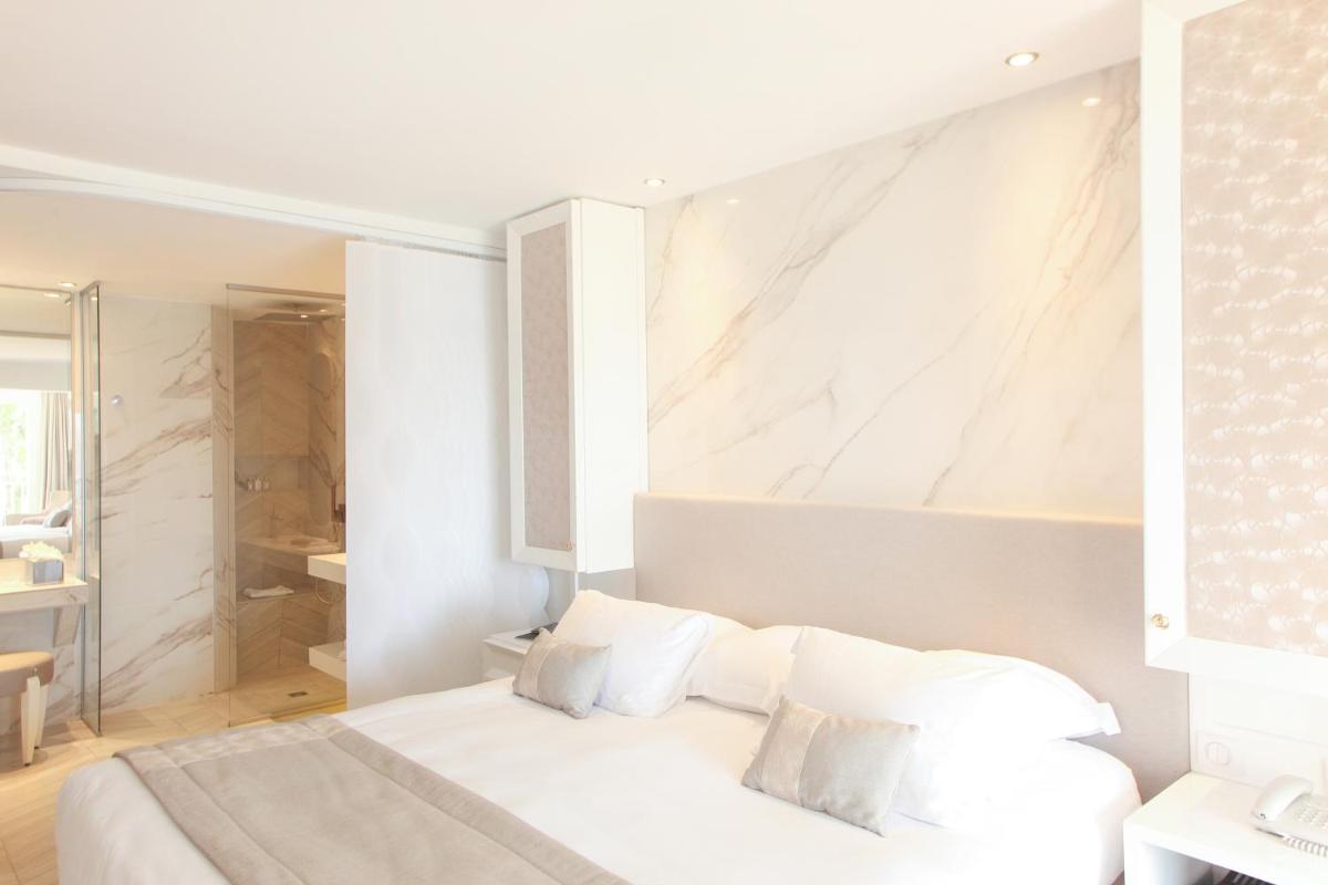 Un ou plusieurs lits dans un hébergement de l'établissement Hôtel Marinca & Spa