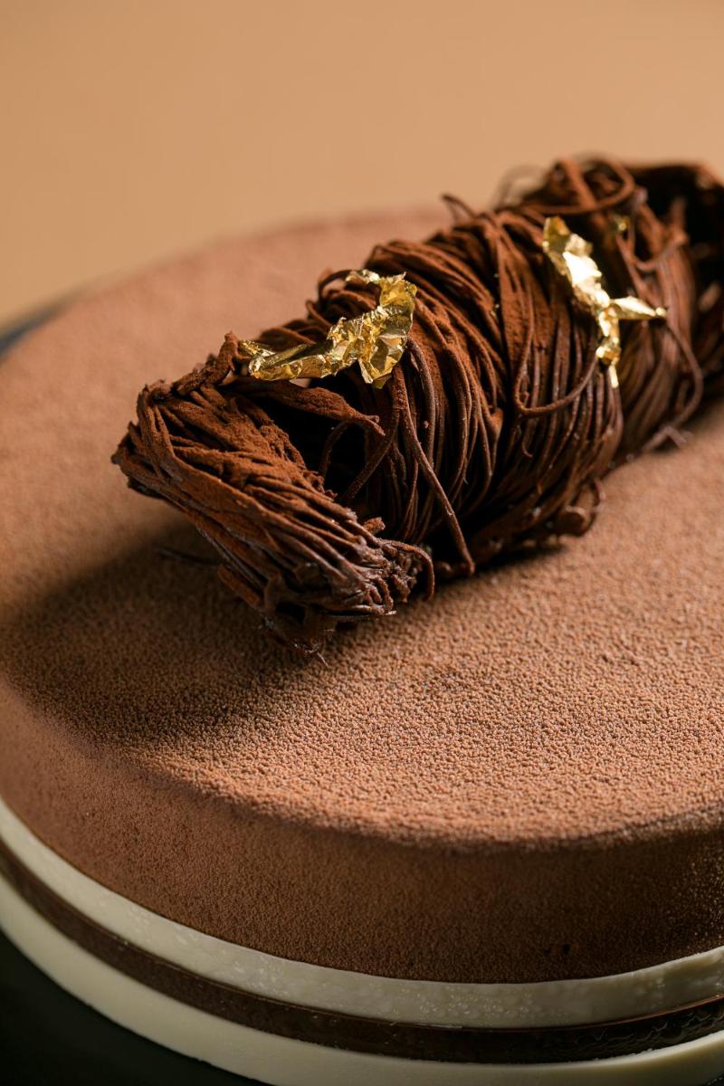 a chocolate cake sitting on top of a table at JW Marriott Mumbai Juhu in Mumbai