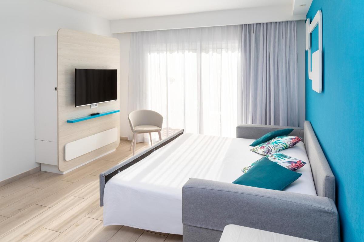 Cama o camas de una habitación en Hotel Tropical Park