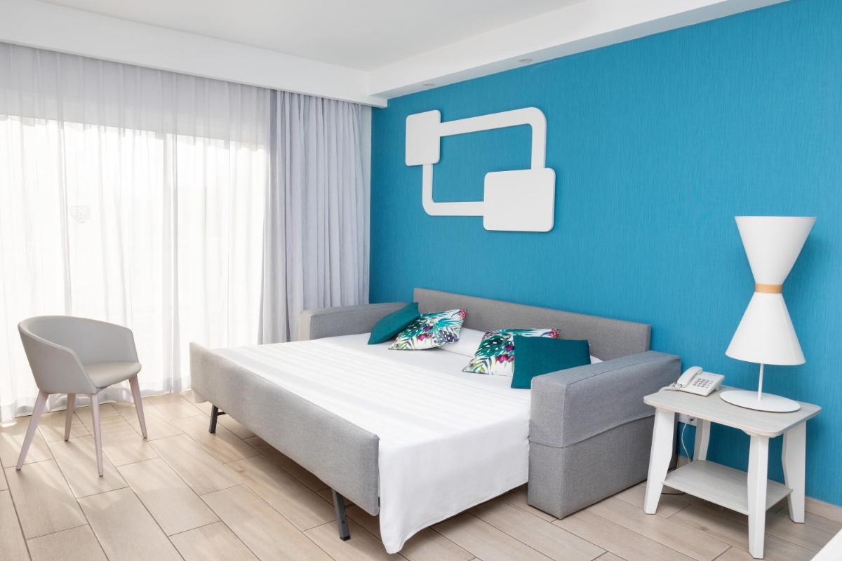 Cama o camas de una habitación en Hotel Tropical Park