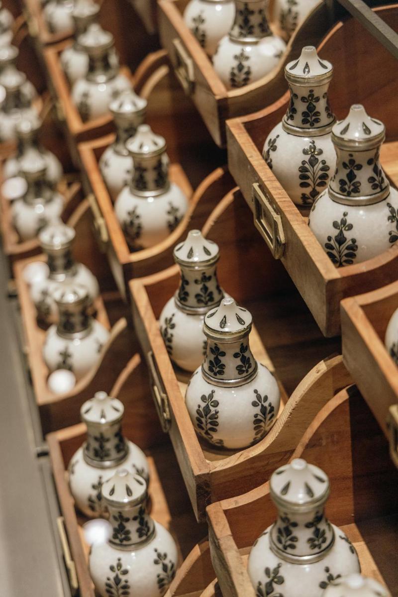 a bunch of vases sitting in wooden boxes at Grand Hyatt Gurgaon in Gurgaon
