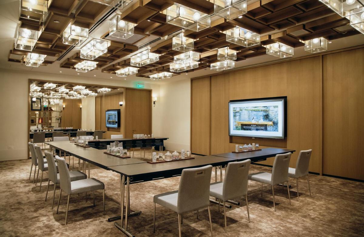 a conference room with a long table and chairs at Grand Hyatt Gurgaon in Gurgaon
