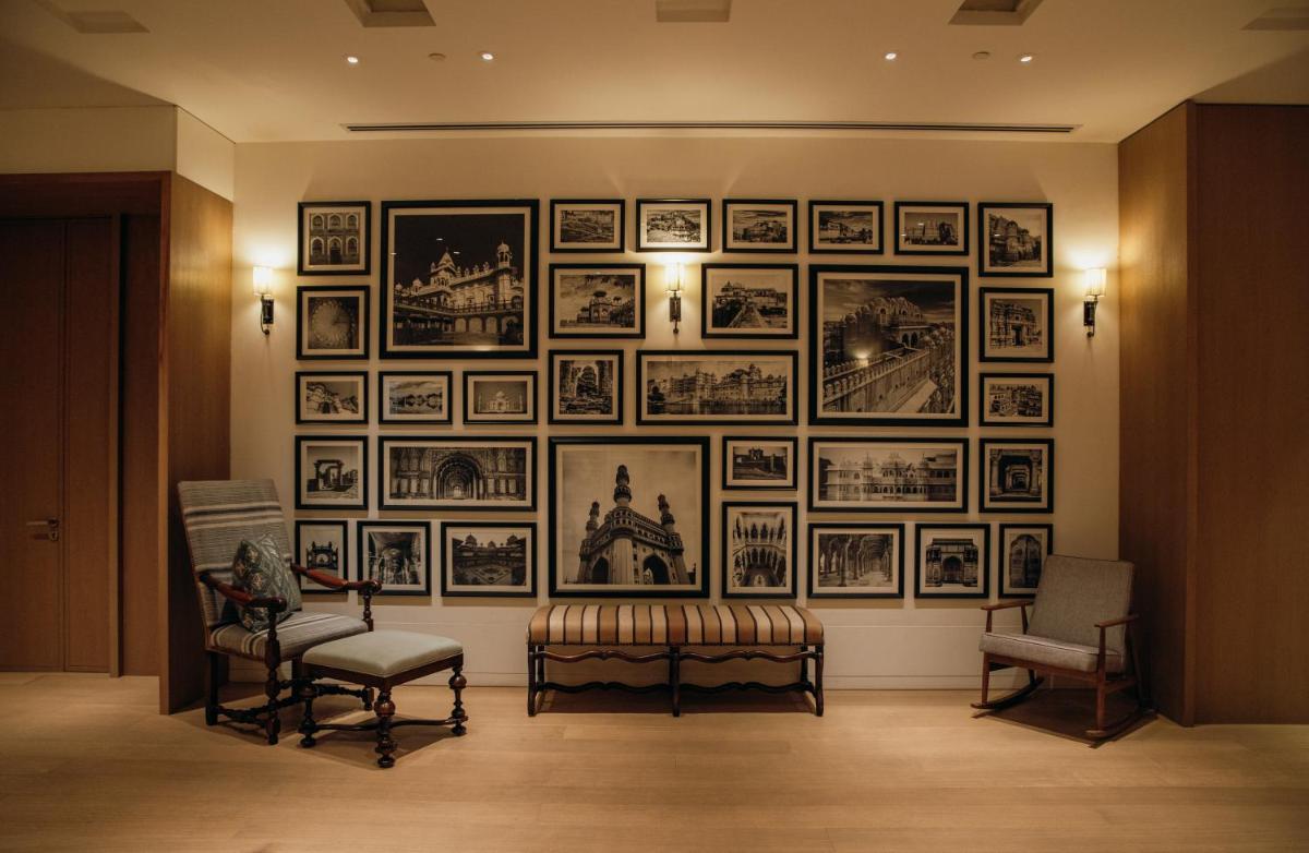 a room with a wall of pictures on the wall at Grand Hyatt Gurgaon in Gurgaon