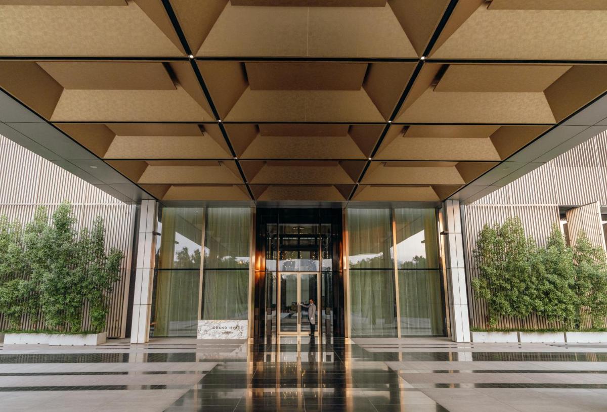 a lobby of a building with a revolving door at Grand Hyatt Gurgaon in Gurgaon