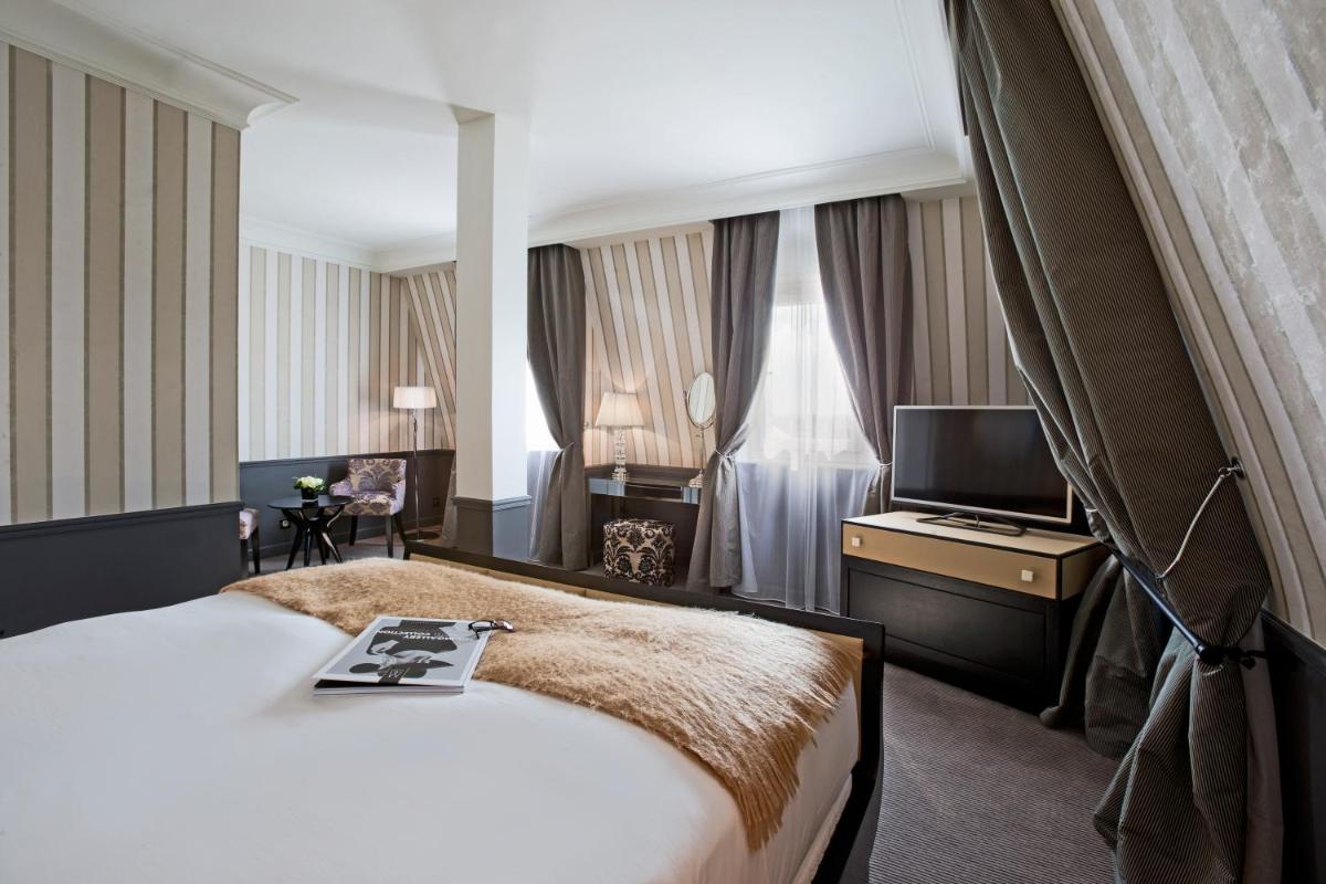 Un ou plusieurs lits dans un hébergement de l'établissement Le Grand Hotel de Cabourg - MGallery Collection