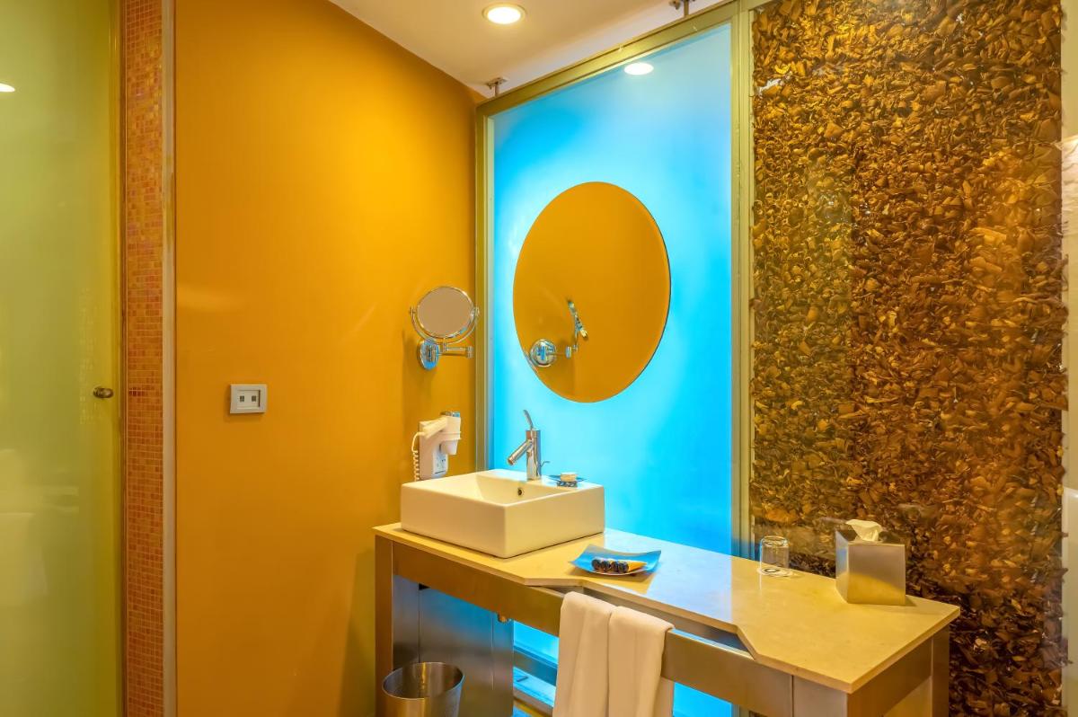 a bathroom with a sink and a shower at O Hotel Pune in Pune