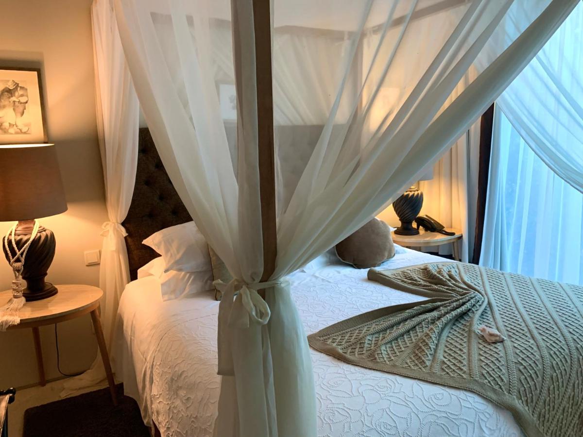 Uma cama ou camas num quarto em Carmo's Boutique Hotel - Small Luxury Hotels of the World