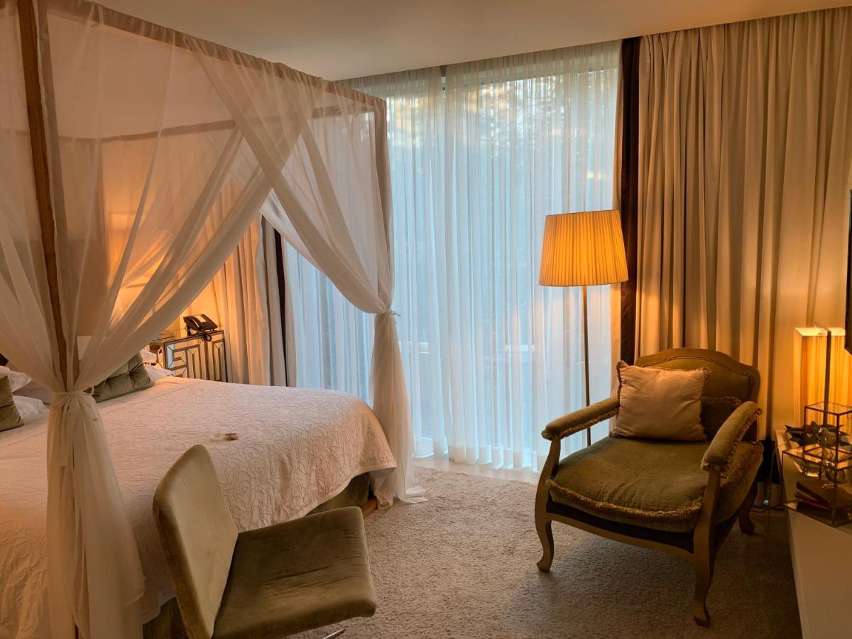 Uma cama ou camas num quarto em Carmo's Boutique Hotel - Small Luxury Hotels of the World