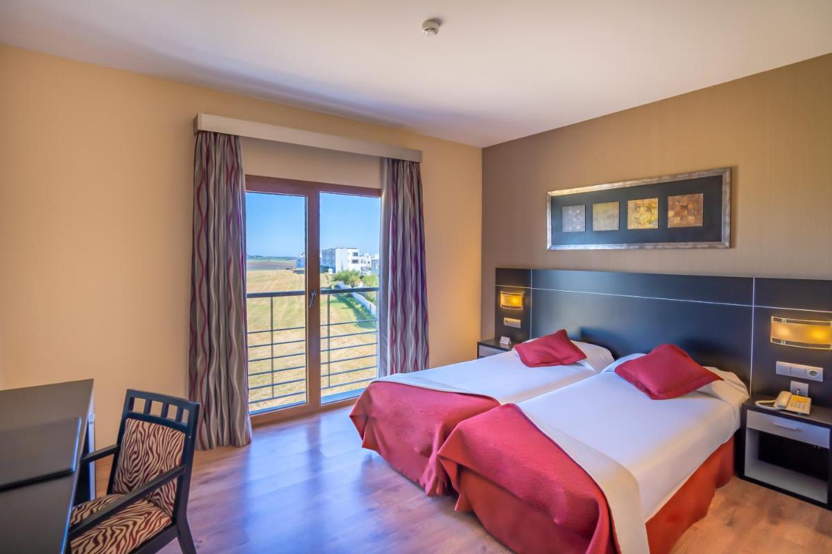 Cama o camas de una habitación en Hotel Andalussia