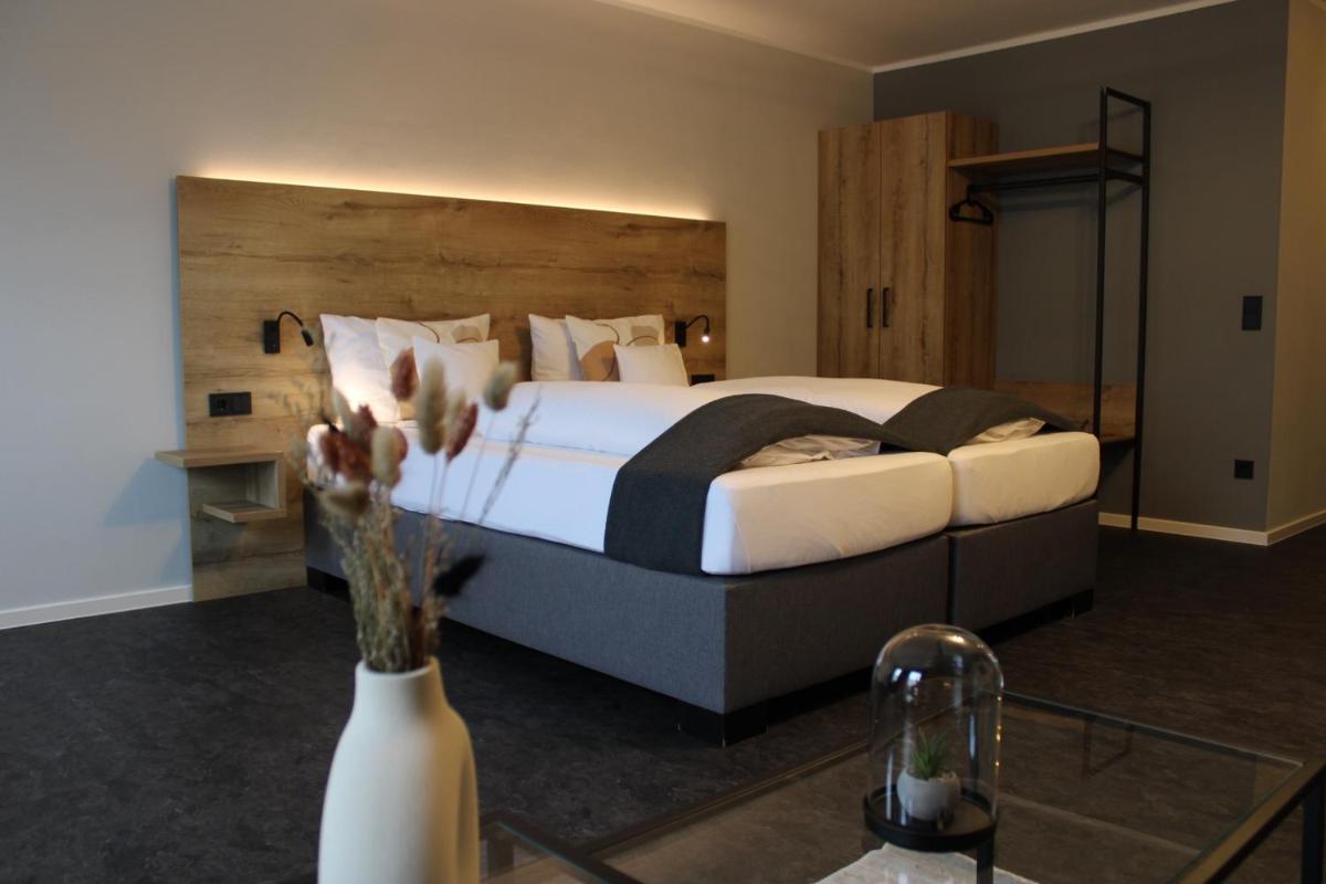 Ein Bett oder Betten in einem Zimmer der Unterkunft Motel Hasetal