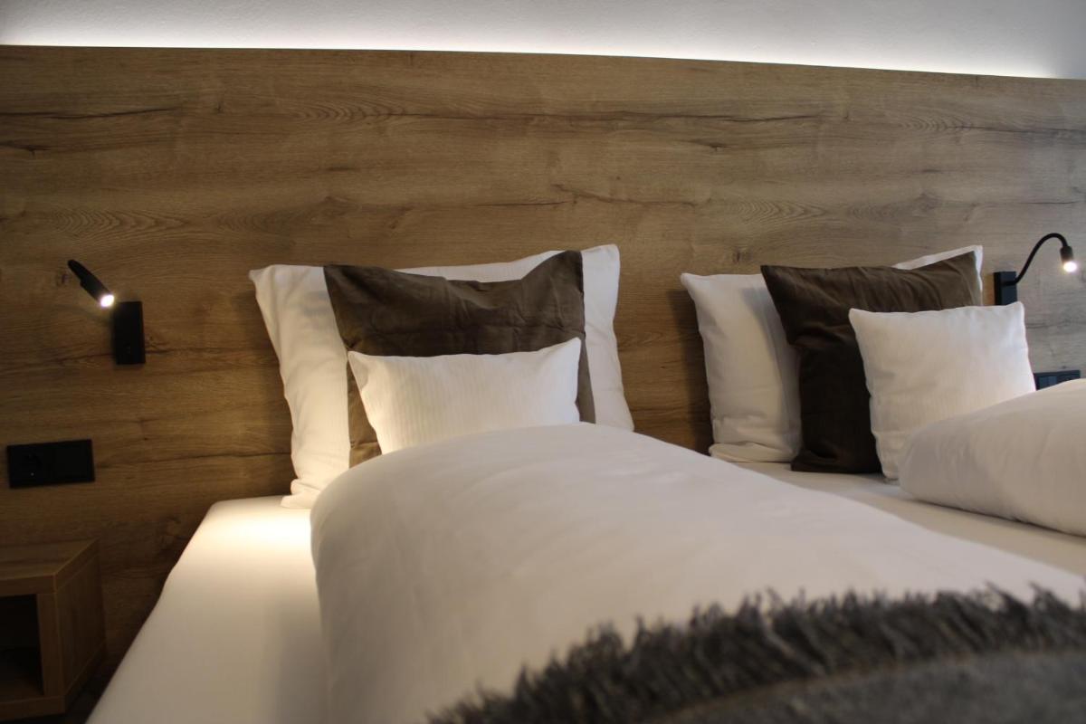 Ein Bett oder Betten in einem Zimmer der Unterkunft Motel Hasetal